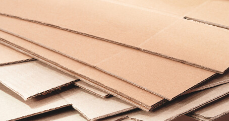Poster - cardboard is neatly placed in a stack for further use