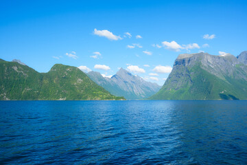 Wall Mural - beautiful mountain lake in norway. nature in fjords. high mountains and reflections on the surface o