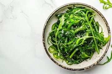 Wall Mural - Seaweed salad on marble table flat lay Room for text