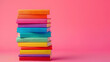© john - Stack of colorful books on pink background, LGBTQ  concept