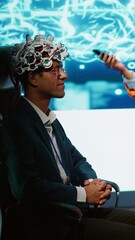 Poster - Vertical video Speaker does EEG headset presentation during tech convention, demonstrating successful implementation of AI in driving forward startup businesses, sharing latest neuroscience