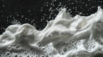 Poster - A close-up of foamy texture on a dark background, suitable for scientific or medical illustration