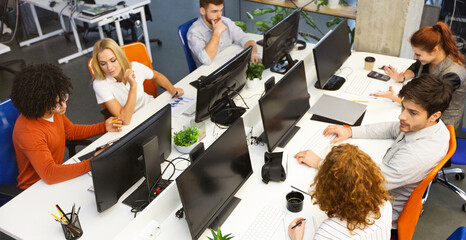 Aufkleber - Group of young business people working together, sitting at coworking office, empty space