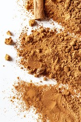 Poster - A pile of cinnamon powder with a single cinnamon stick on top