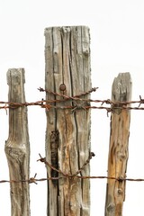 Sticker - A close-up shot of a wooden fence with barbed wire, often used for security purposes