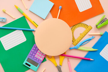 Wall Mural - School supplies with calculator, copybook and blank card on beige background. Top view