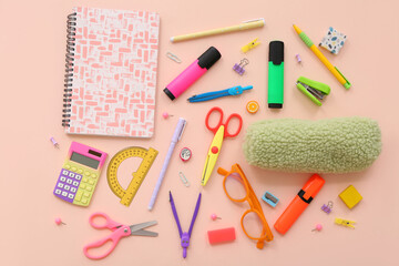 Wall Mural - School supplies with scissors, markers and pencil case on beige background. Top view