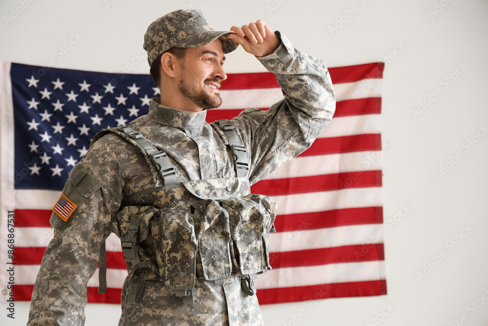 Male soldier against USA flag on light background. Labour Day celebration