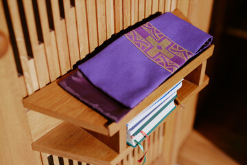 Wall Mural - High angle view of embroidered gospel bookmarks and books on shelves in church