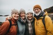 © NikoG - Portrait of a smiling group of senior hikers in rain jackets