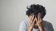 © daratorn - A man holding their head in pain, headache, on white background, with white space
