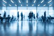 © Faustudio - Blurred office background with modern meeting room and business silhouettes.