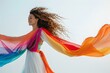 © Adobe Contributor - carefree black woman dancing with a rainbow scarf