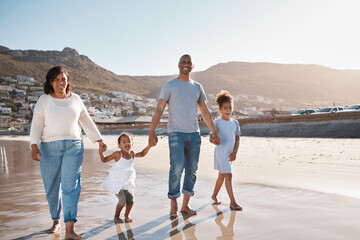 Poster - Travel, parents and kids walking on beach for vacation, holiday or weekend trip together. Family, young girls and happy woman with man at coast for bonding, support or summer break in Maldives