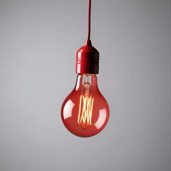 Wall Mural - close up isolated hanging red lightbulb with copy space background, representing great ideas