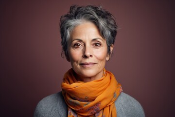 Wall Mural - A woman with short gray hair and a scarf around her neck