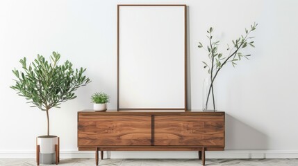Poster - A blank poster frame hangs on a white wall in a modern living room. The room features a wooden dresser, potted plants, and decorative branches in a vase