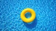 © Musarrof - top view of yellow swimming pool ring float in blue water. concept color summer. copy space in left