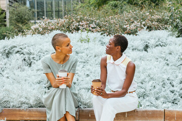 Businesswomen enjoying coffee break in garden