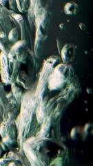 Poster - Black background. Shooting underwater. Stock footage. Impulsively moving bubbles of pure water and floating different particles.