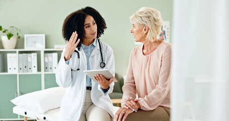 Canvas Print - Woman, doctor and consulting with patient in checkup on tablet for medical results, diagnosis or prescription at hospital. Female person talking to client for consultation, help or advice at clinic