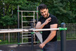 © Vitaliy - An athlete suffering from severe shoulder pain injured his joint while training on the parallel bars