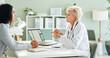 © peopleimages.com - Mature woman, doctor and consulting with patient for medication, prescription or diagnosis at hospital. Female person talking to client for dosage, steps or list in consultation at office or clinic