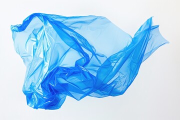 Poster - Single blue plastic bag lying on a clean white surface, useful for still life photography and product placement