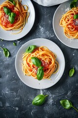 Wall Mural - Freshly cooked spaghetti with homemade tomato sauce and garnished with basil leaves