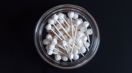 Poster - A clear glass jar containing soft white cotton buds for makeup or crafts use