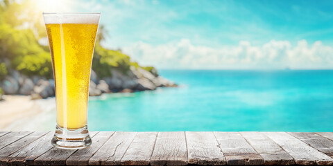 Poster - Glass of beer on a table with a stunning sea and beach background