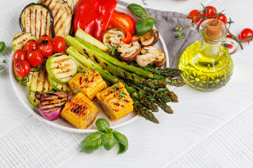 Wall Mural - Assorted grilled vegetables on a plate, showcasing a colorful and healthy meal