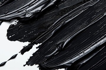 Poster - Close-up shot of black paint on a white surface, ideal for designs or illustrations