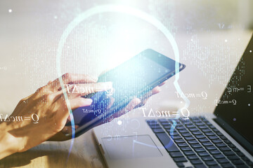 Poster - Creative artificial Intelligence concept with human head hologram and finger clicks on a digital tablet on background. Multiexposure