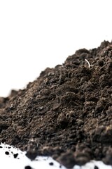 Poster - A pile of dirt sits atop a white surface, ideal for use in still life photography or as a prop for other images