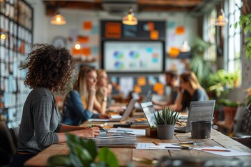 Poster - Woman Working on Laptop in Modern Office With Coworkers