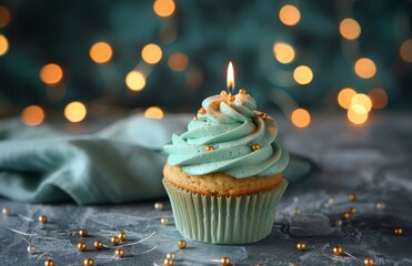 Single Birthday Cupcake With Candle and Decorations on a Table