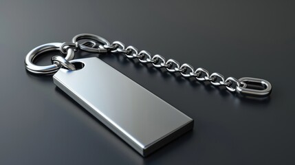 Close-up of a sleek metal keychain with a rectangular tag, placed on a dark surface, highlighting its modern design.