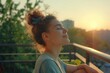 © darshika - Relaxed young woman breathing fresh air on balcony in the morning