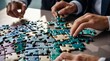 © YENI - Closeup photo of businesspeople holding jigsaw puzzle