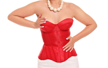 Wall Mural - Woman in red corset on white background, closeup