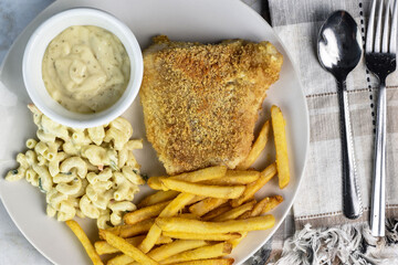 Wall Mural - baked haddock  with fries and macaroni salad