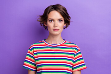 Wall Mural - Photo of attractive business lady looking on camera serious expression wear striped shirt isolated purple pastel color background