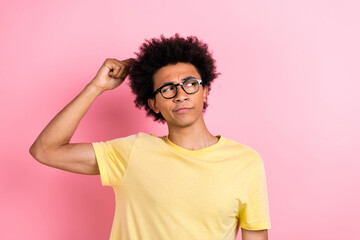 Sticker - Photo of minded creative handsome man arm fingers scratch head look empty space isolated on pink color background