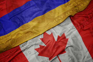 Wall Mural - waving colorful flag of armenia and national flag of canada on the dollar money background. finance concept.