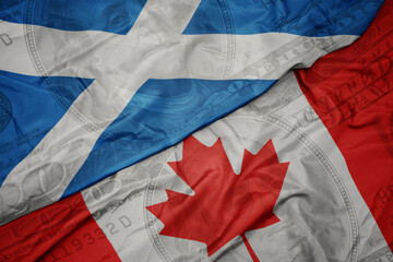 Poster - waving colorful flag of scotland and national flag of canada on the dollar money background. finance concept.