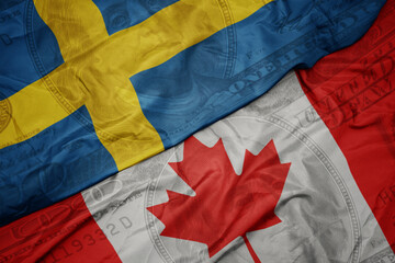 Wall Mural - waving colorful flag of sweden and national flag of canada on the dollar money background. finance concept.