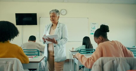 Poster - Teacher, students and giving paper in classroom for exam, test and assessment. People, female educator and learner in high school for education, results and learning for skills and development