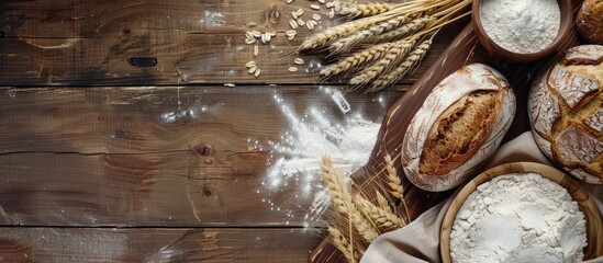 Poster - Wooden table with rustic bread, wheat ears, and white flour, all set up for display with a spacious copy space image.