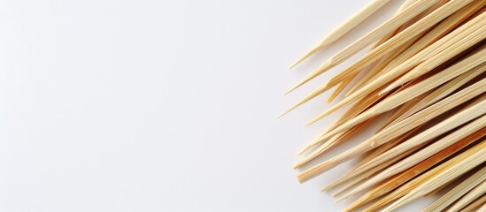 Aufkleber - Toothpicks made from bamboo set against a clear white copy space image.